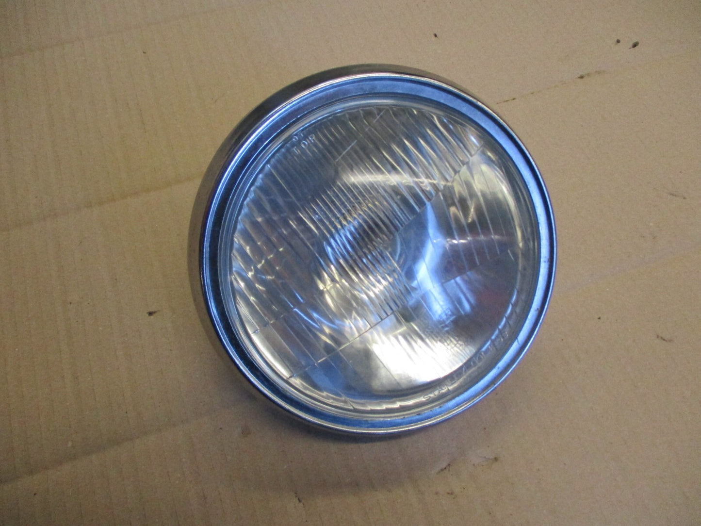 Phare + optique STANLEY 0001-1293 + cerclage pour Honda 125 CM - JC05