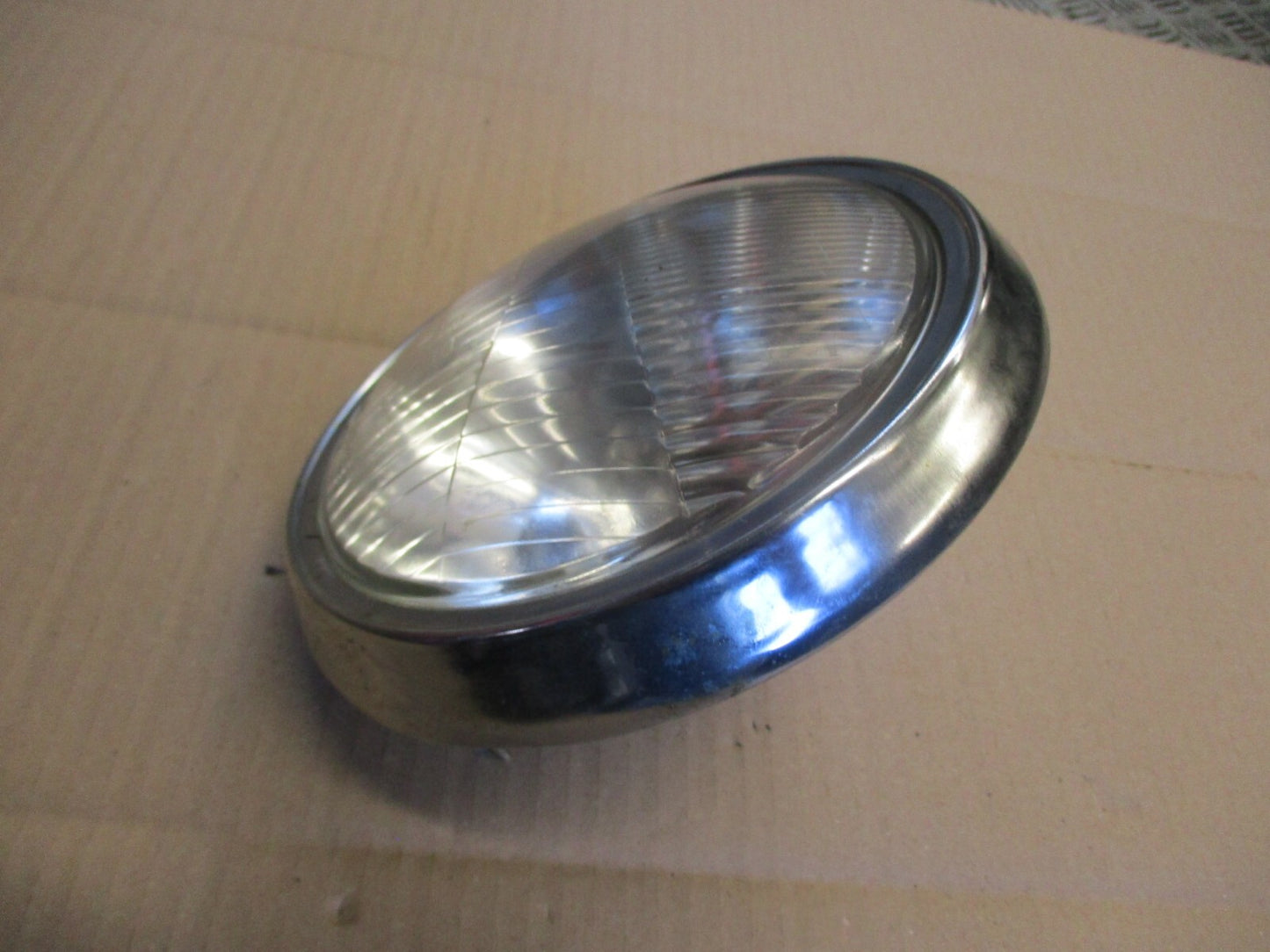 Phare + optique STANLEY 0001-1293 + cerclage pour Honda 125 CM - JC05