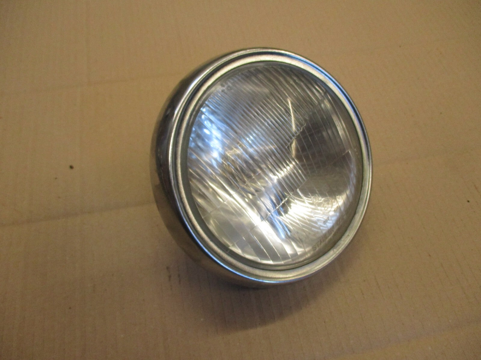 Optique de phare STANLEY 0001-1293 + cerclage pour Honda 125 CM - JC05