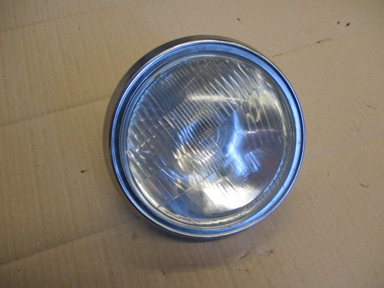 Phare + optique STANLEY 0001-1293 + cerclage pour Honda 125 CM - JC05
