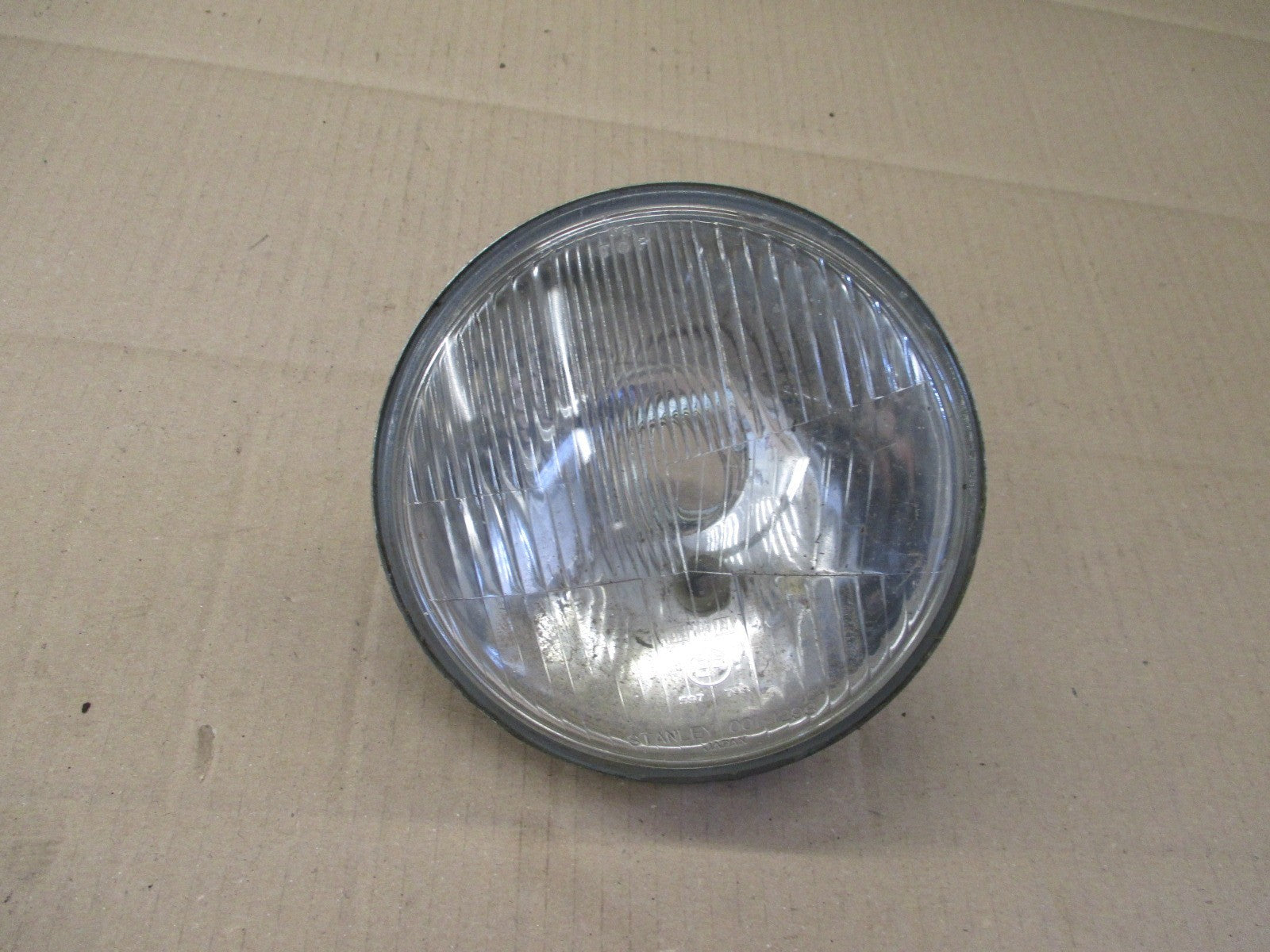 Optique de phare STANLEY 0001-1293 pour Honda 125 CM - JC05