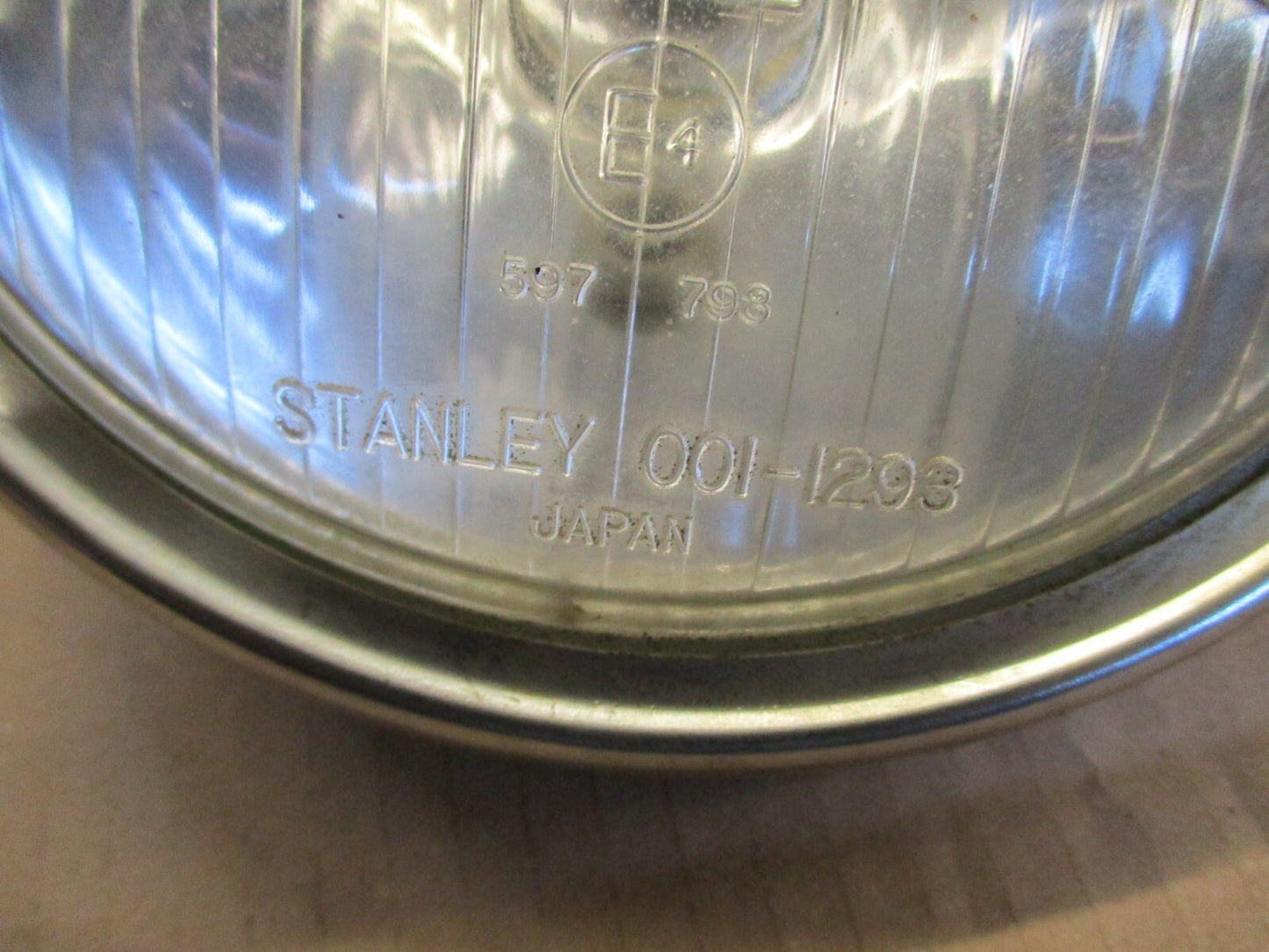 Optique de phare STANLEY 0001-1293 + cerclage pour Honda 125 CM - JC05
